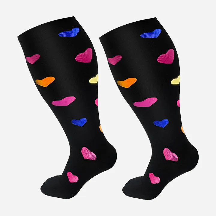 Plus size compression socks for extra wide calf in blue ECG pattern on white background