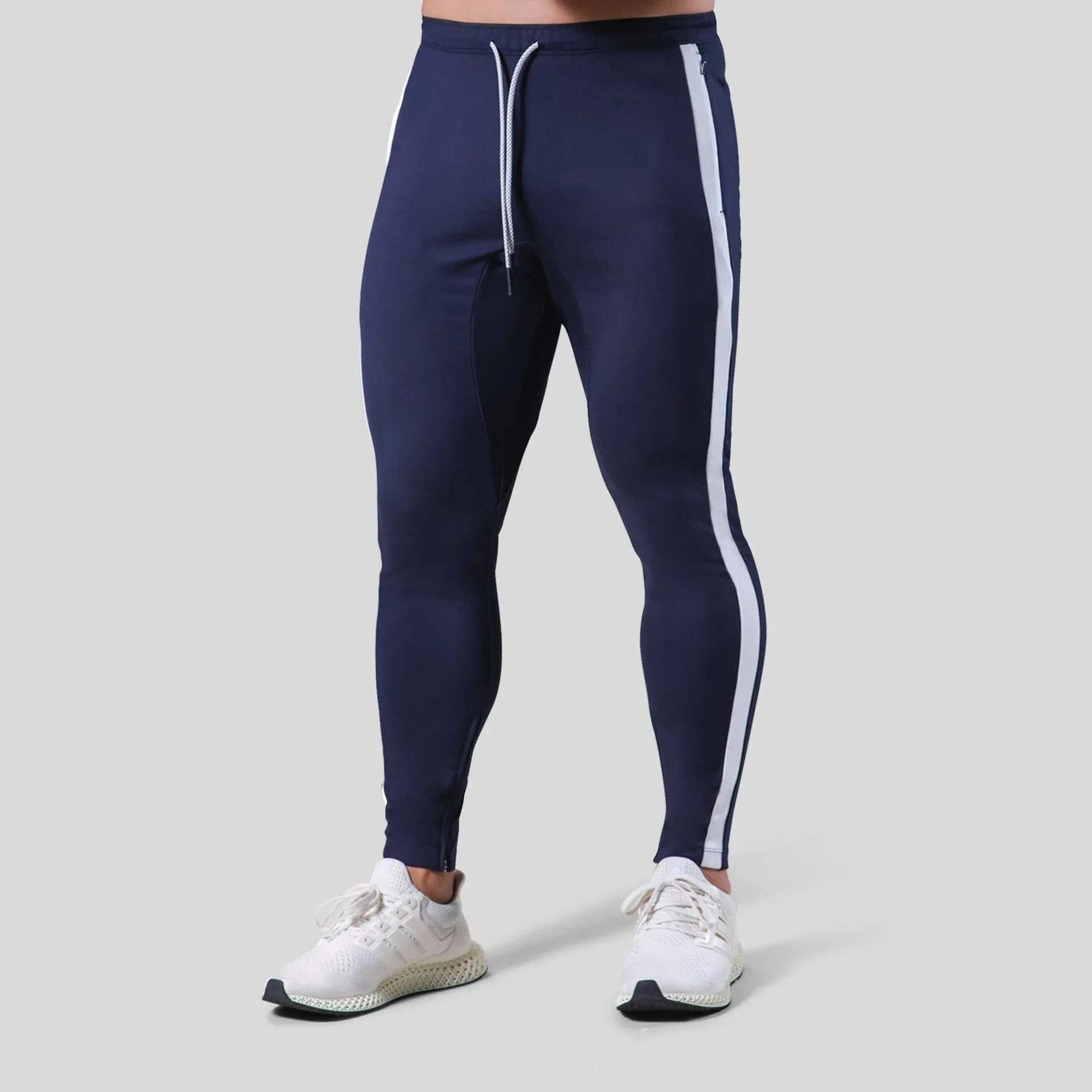 Men's polyester fitness training pants in green, black, navy blue and grey colours for gym workout and bodybuilding
