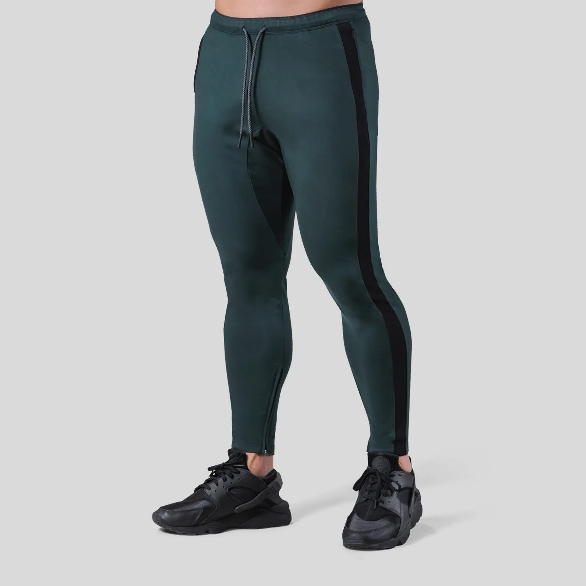 Men's polyester fitness training pants in green, black, navy blue and grey colours for gym workout and bodybuilding