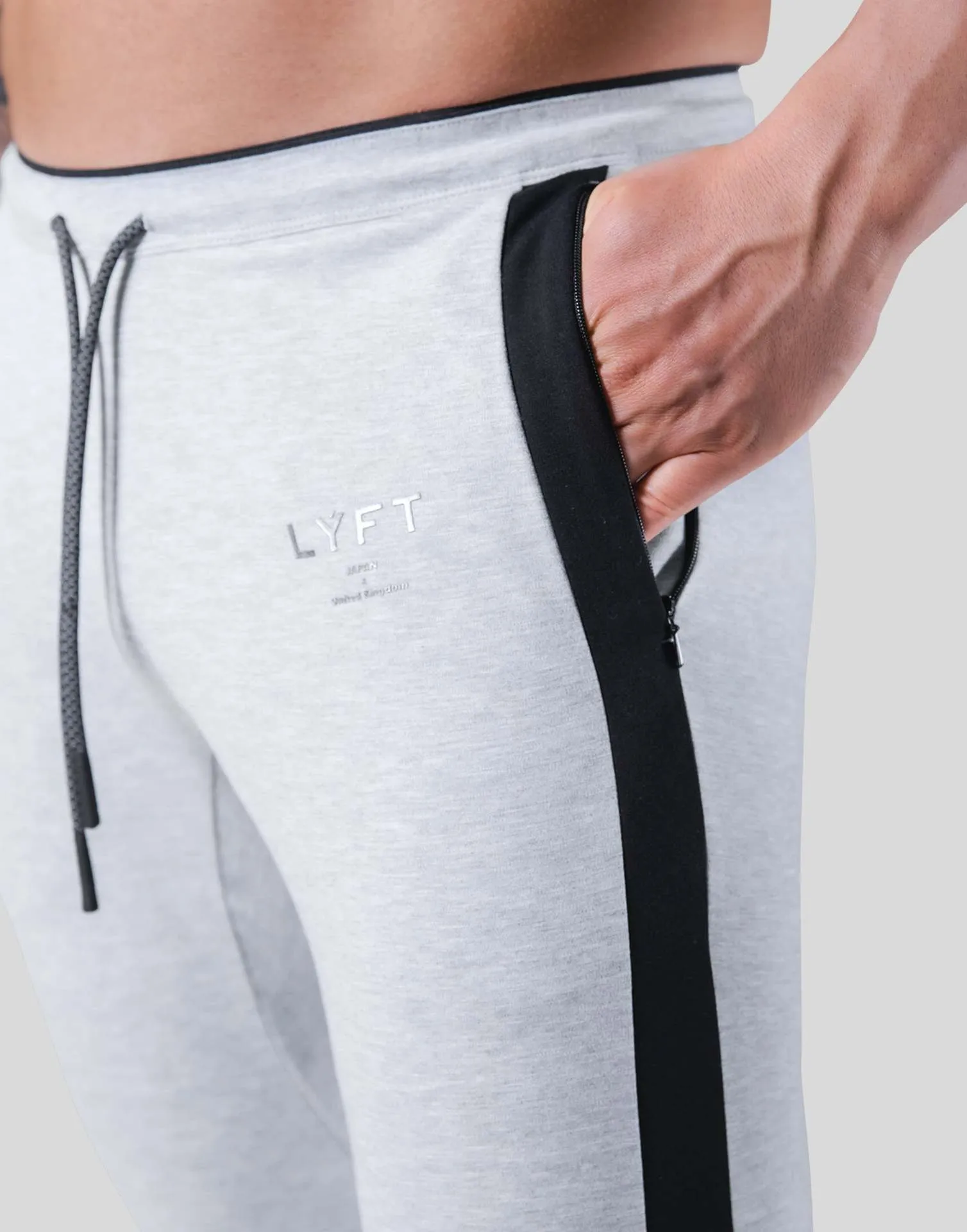 Men's polyester fitness training pants in green, black, navy blue and grey colours for gym workout and bodybuilding