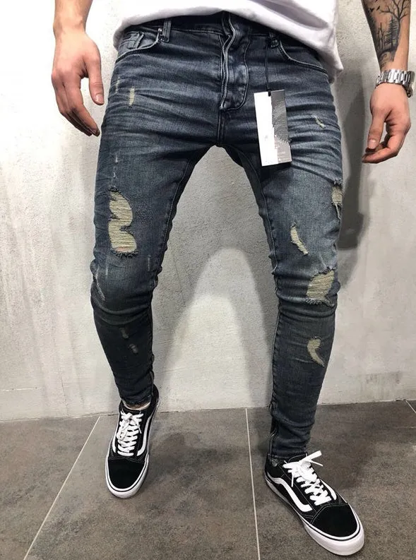 Men's gray blue stretch biker jeans with hole details, slim fit, on a model