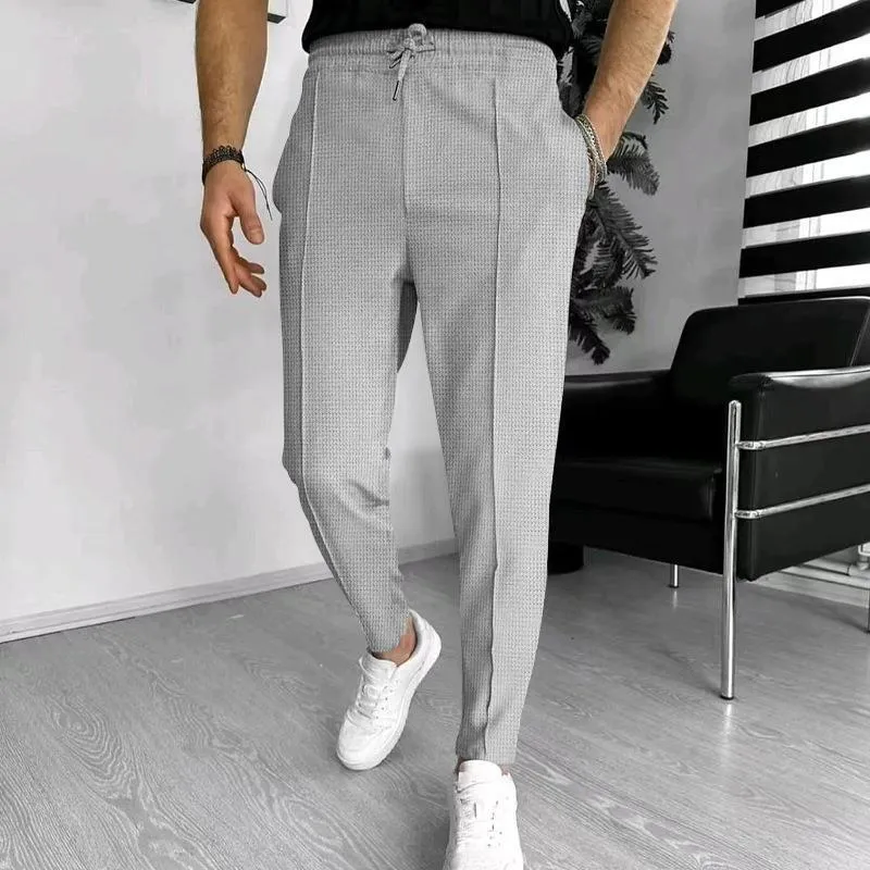 Men's drawstring straight-leg casual pants in solid colour, high-waisted with elastic waffle fabric, front view