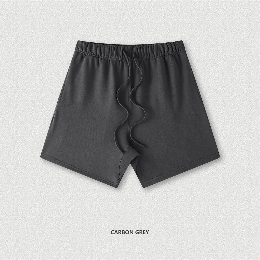 Men's cotton loose fit solid colour shorts in assorted colours like black, navy, and grey