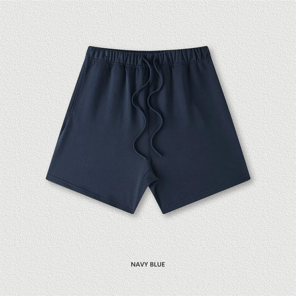 Men's cotton loose fit solid colour shorts in assorted colours like black, navy, and grey