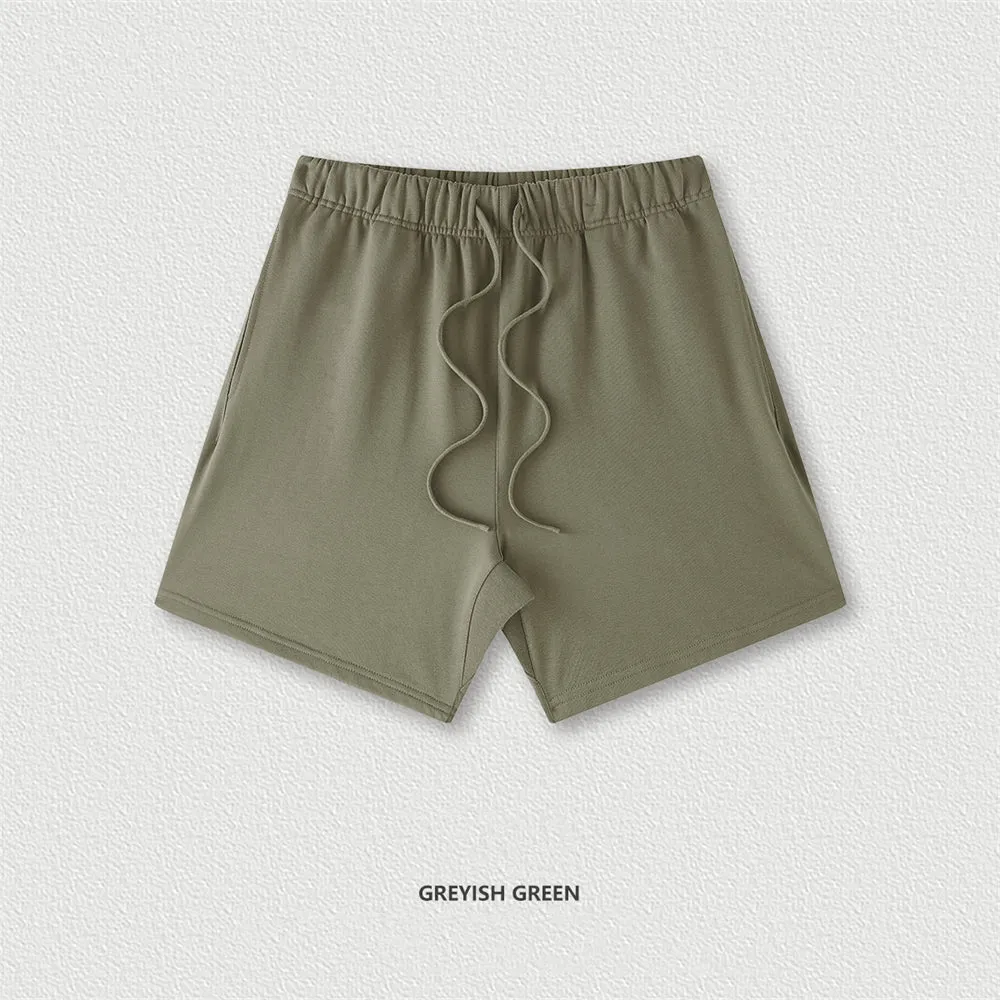 Men's cotton loose fit solid colour shorts in assorted colours like black, navy, and grey