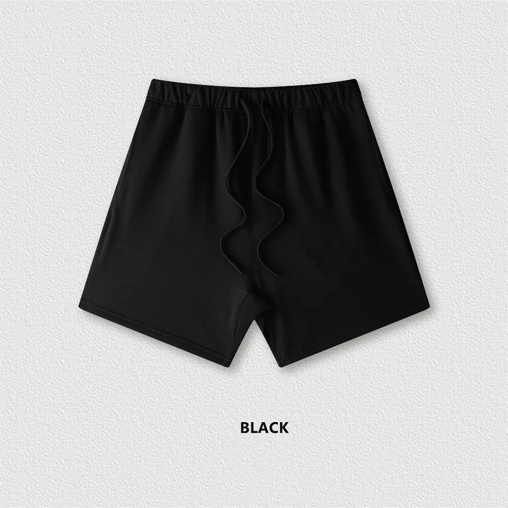 Men's cotton loose fit solid colour shorts in assorted colours like black, navy, and grey