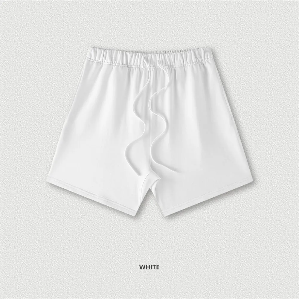 Men's cotton loose fit solid colour shorts in assorted colours like black, navy, and grey