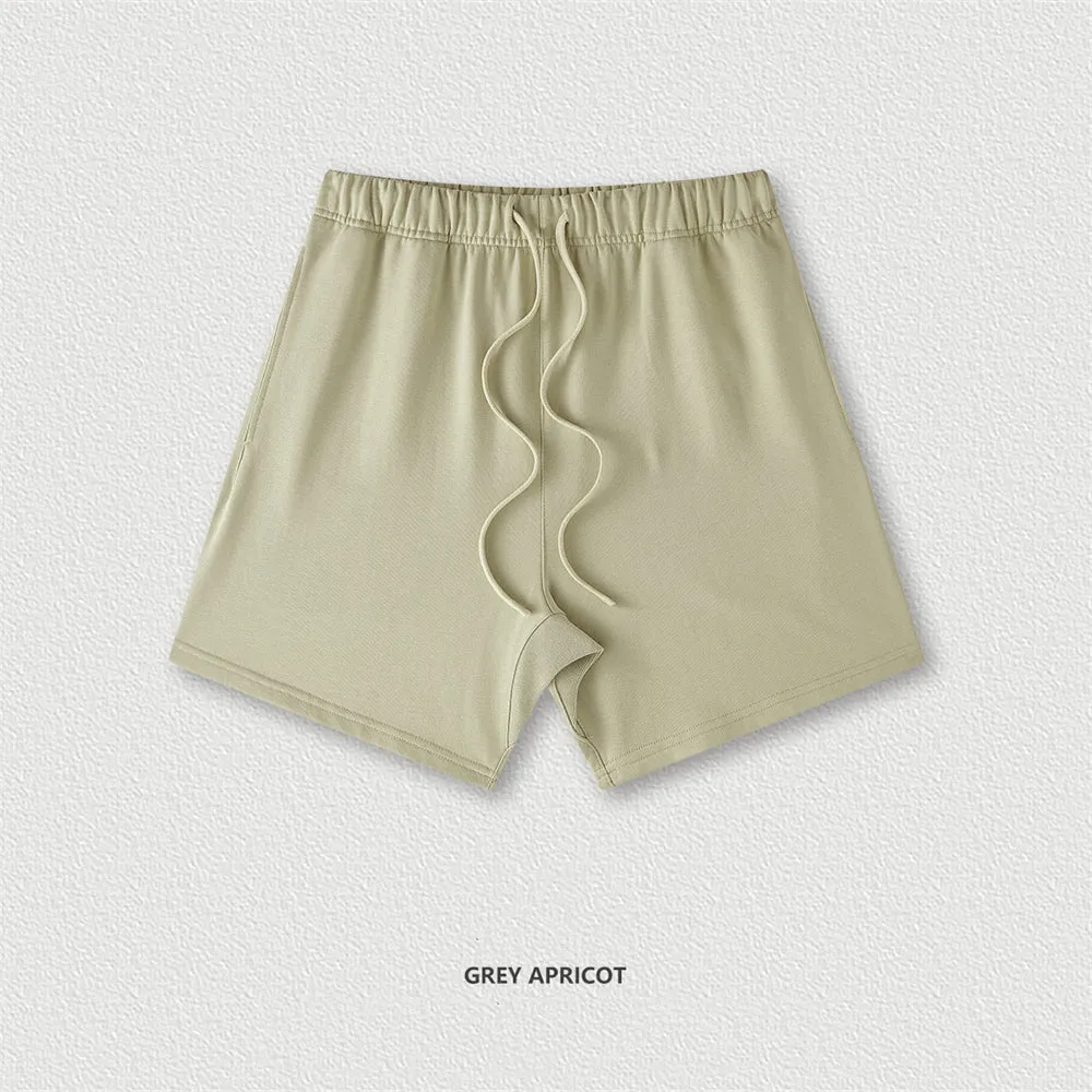 Men's cotton loose fit solid colour shorts in assorted colours like black, navy, and grey