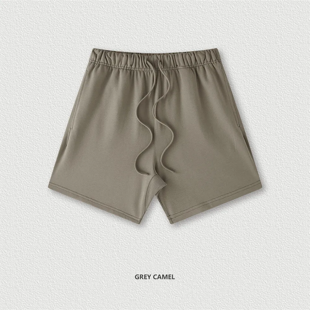 Men's cotton loose fit solid colour shorts in assorted colours like black, navy, and grey