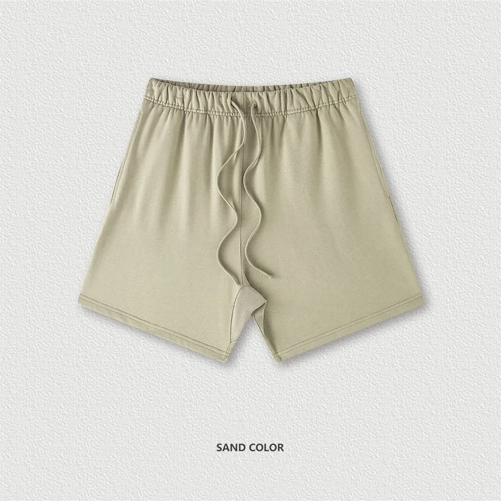 Men's cotton loose fit solid colour shorts in assorted colours like black, navy, and grey