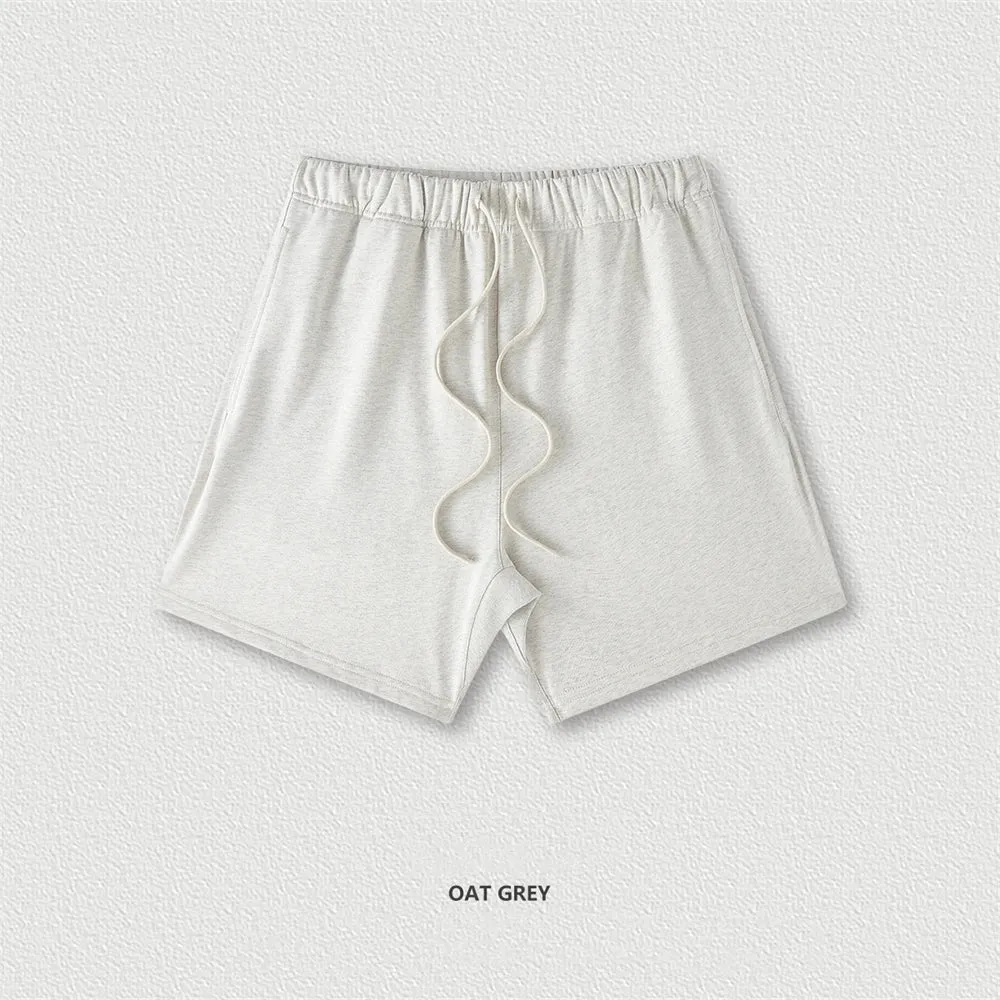 Men's cotton loose fit solid colour shorts in assorted colours like black, navy, and grey