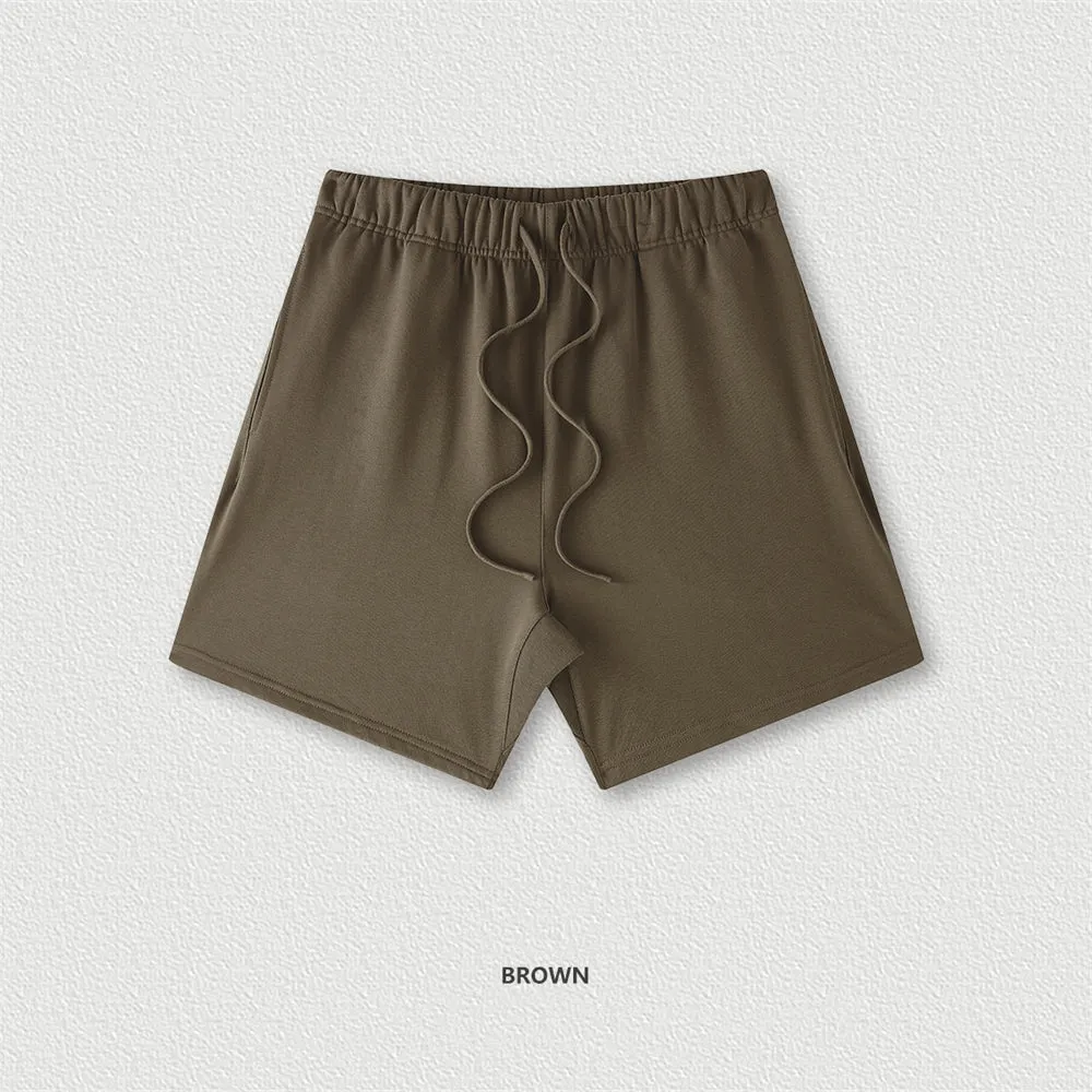Men's cotton loose fit solid colour shorts in assorted colours like black, navy, and grey