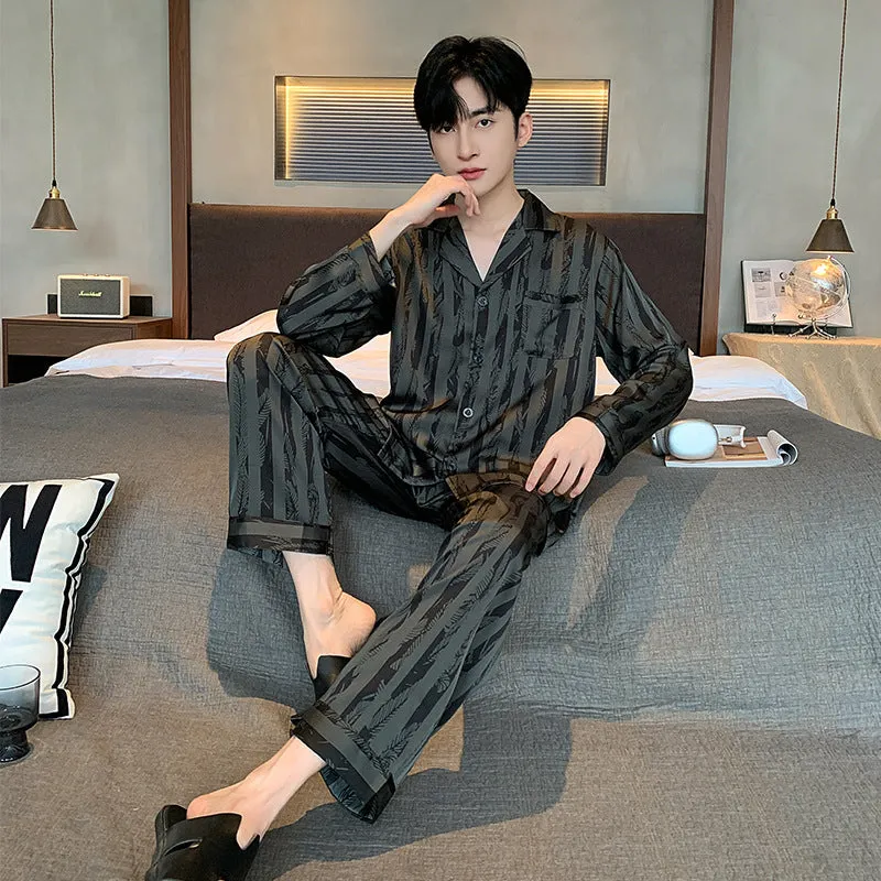 Men's black striped ice silk pajama two-piece set with V-neck top and long trousers.