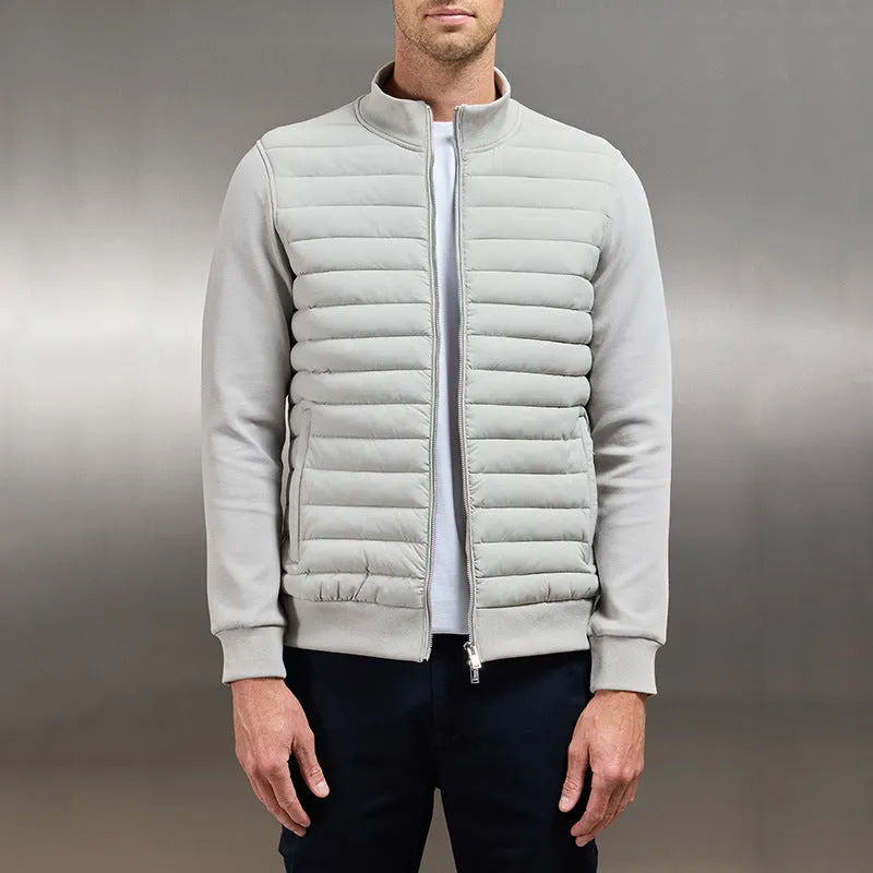 Men's lightweight stand collar coat with knitted stitching in solid colour, available in black, light gray, and navy blue