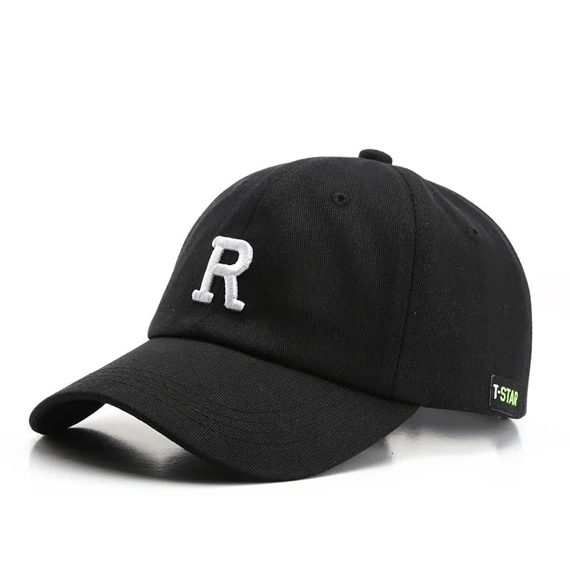 Adjustable cotton baseball cap with embroidered letter R in beige colour, dome style, unisex design