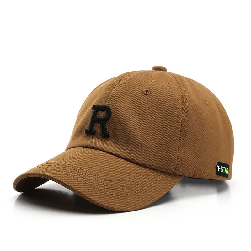 Adjustable cotton baseball cap with embroidered letter R in beige colour, dome style, unisex design