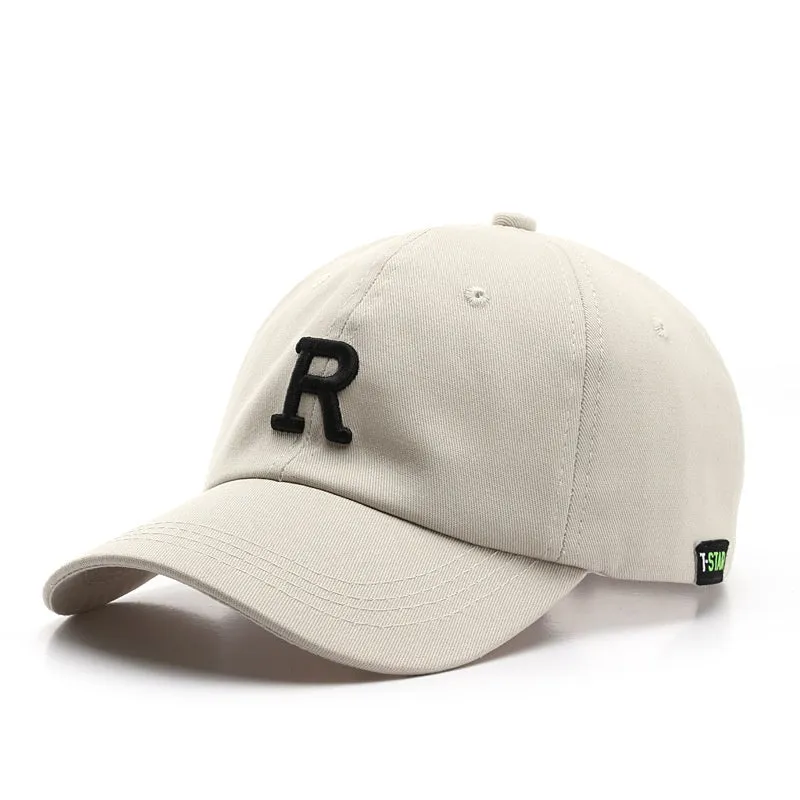 Adjustable cotton baseball cap with embroidered letter R in beige colour, dome style, unisex design