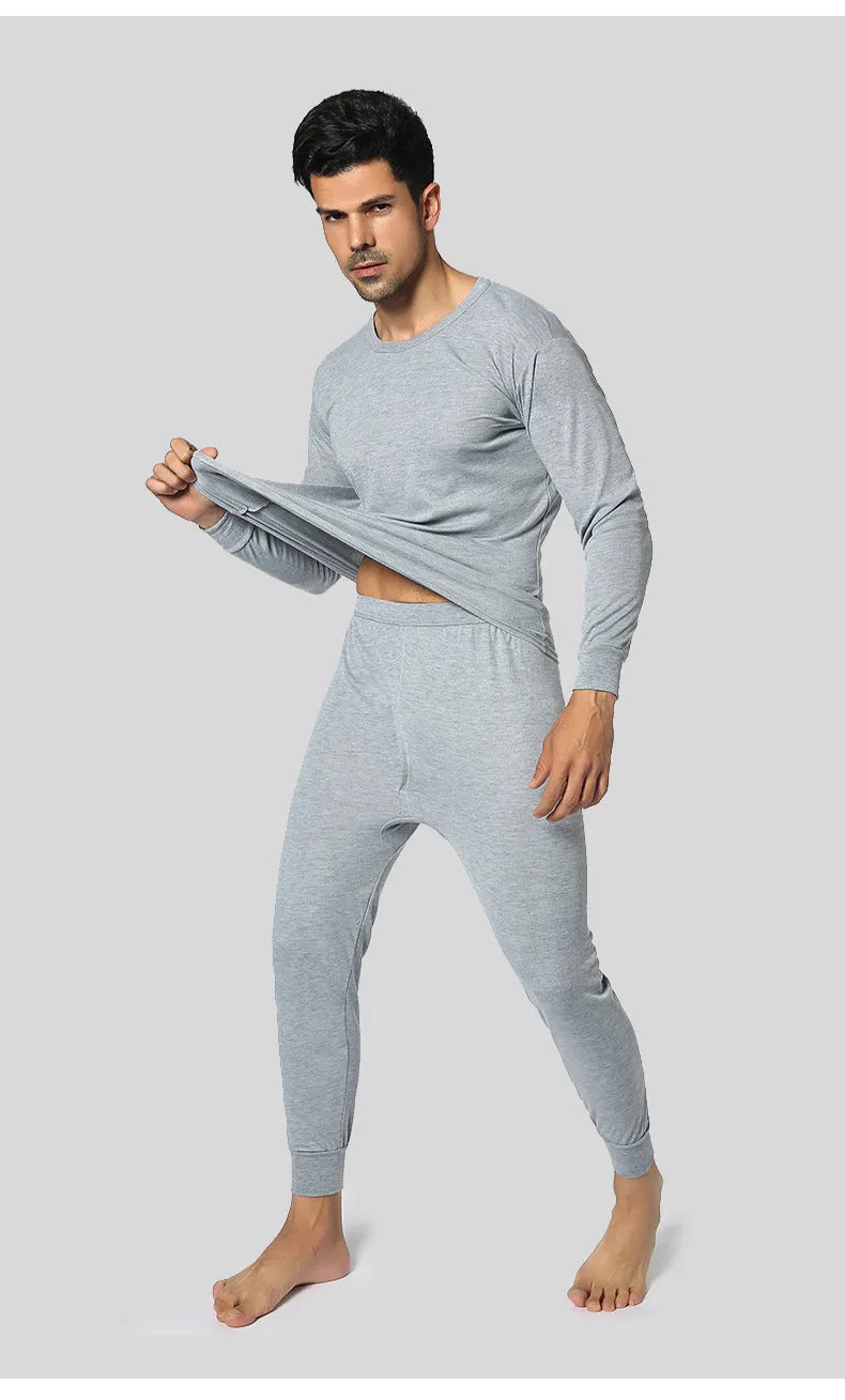 Men's round neck polyester thermal underwear suit in black with slim fit top and bottom on white background