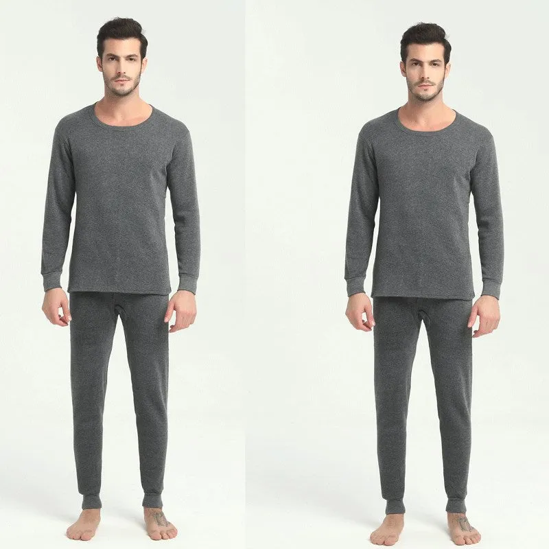 Men's round neck polyester thermal underwear suit in black with slim fit top and bottom on white background