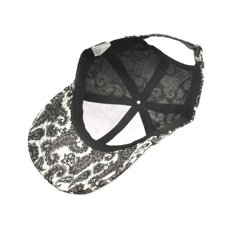 Paisley pattern printed baseball cap in blue with dome crown style on a white background.
