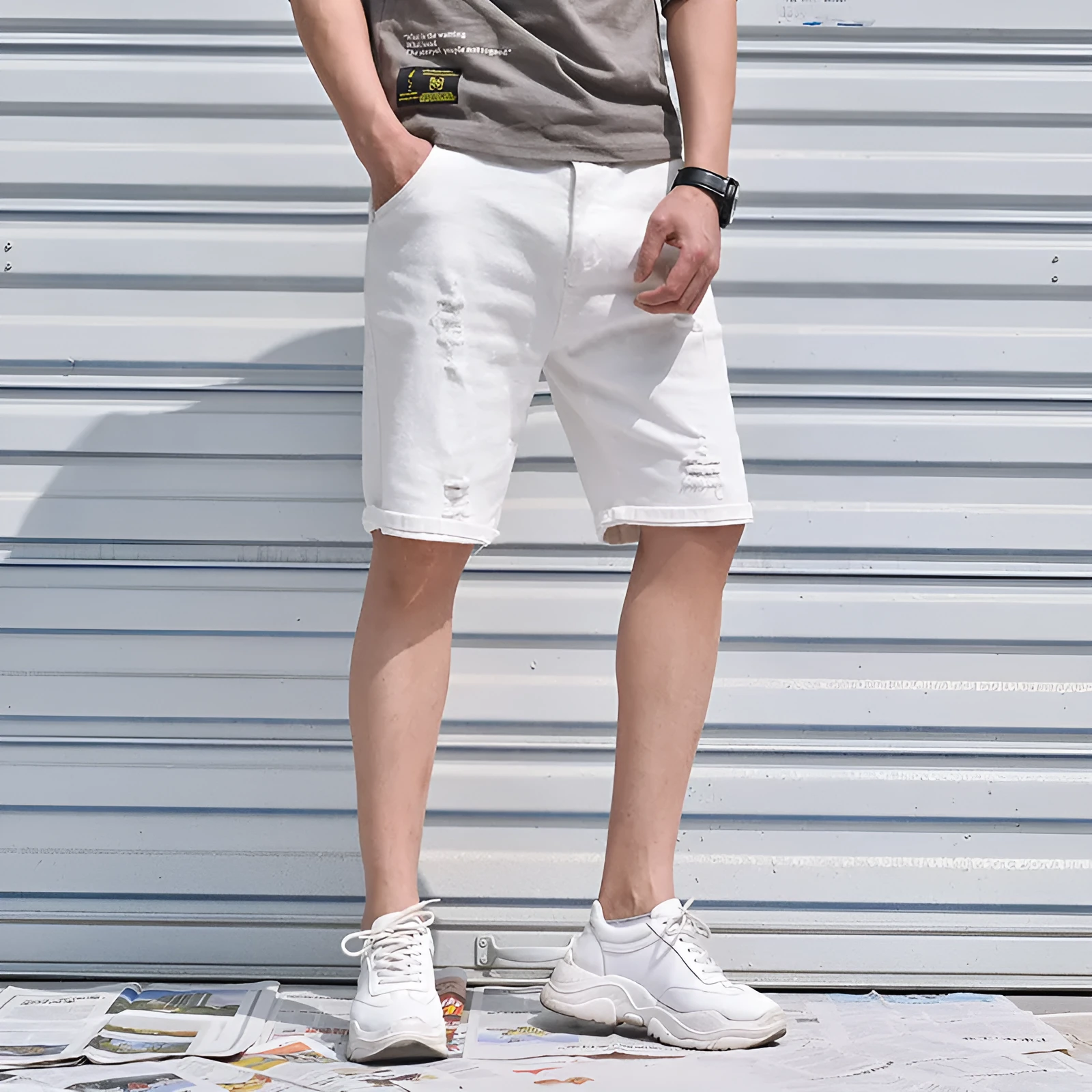Men's cotton denim shorts in black with loose straight-leg cut and mid-waist zipper closure