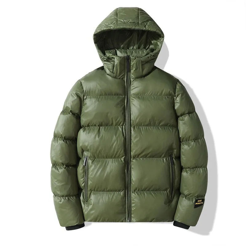 Loose fit solid colour hooded cotton jacket in army green with side seam pockets on one person