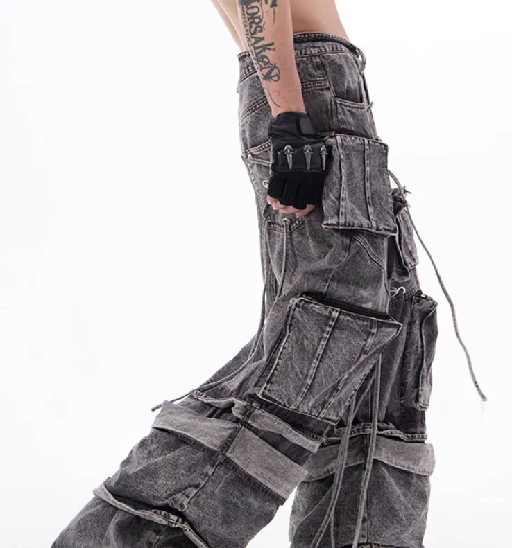 Grey distressed denim overalls with rope stitching on a hanger