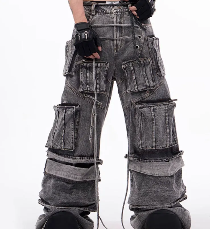 Grey distressed denim overalls with rope stitching on a hanger