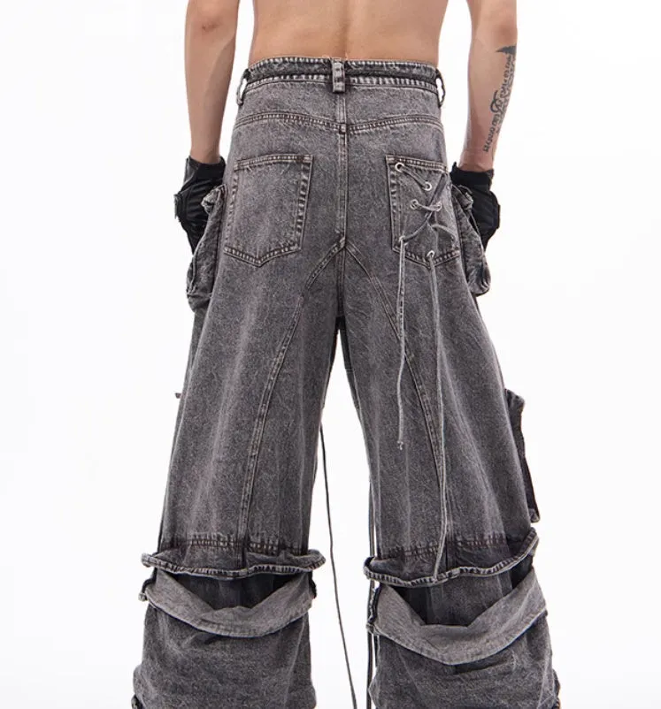 Grey distressed denim overalls with rope stitching on a hanger