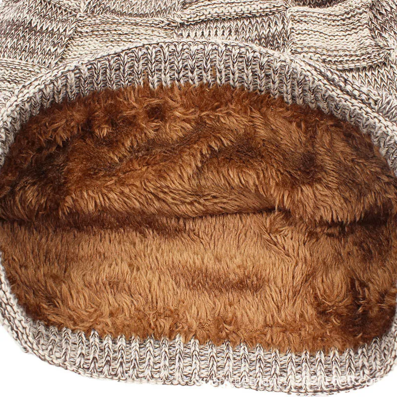 Wool knitted beanie hat in khaki, dome top, brimless style on model