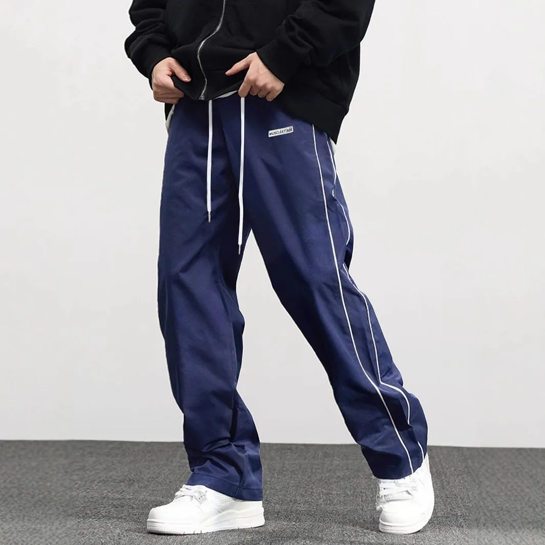 Men's loose fit polyester cargo trousers with side pockets in black, navy blue, and dark green