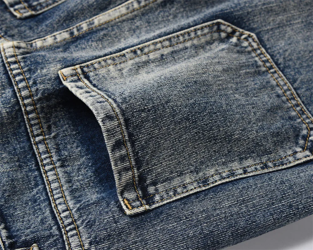 Men's blue denim punk loose straight trousers on a model, casual fit