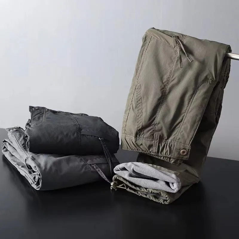 Man wearing thickened warm windproof waterproof fleece lined cotton trousers in army green with belt and double-layer waistband