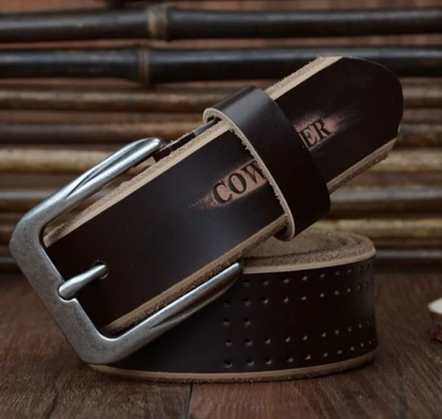 Men's leather belt in black with square alloy buckle on a dark background