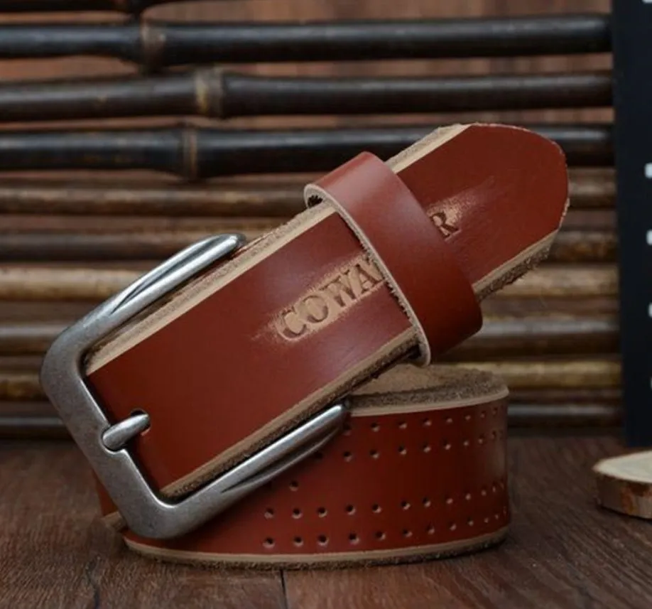 Men's leather belt in black with square alloy buckle on a dark background