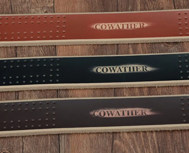 Men's leather belt in black with square alloy buckle on a dark background