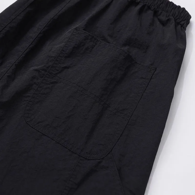 Black paratrooper pants with elastic waist and baggy style European American high street cut