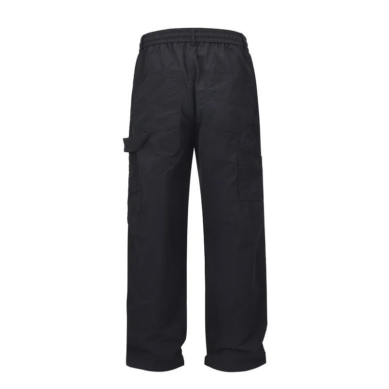 Black paratrooper pants with elastic waist and baggy style European American high street cut