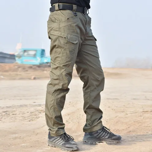 Outdoor multi-legged tactical pants in khaki cotton blend with multiple pockets on legs, shown against natural background