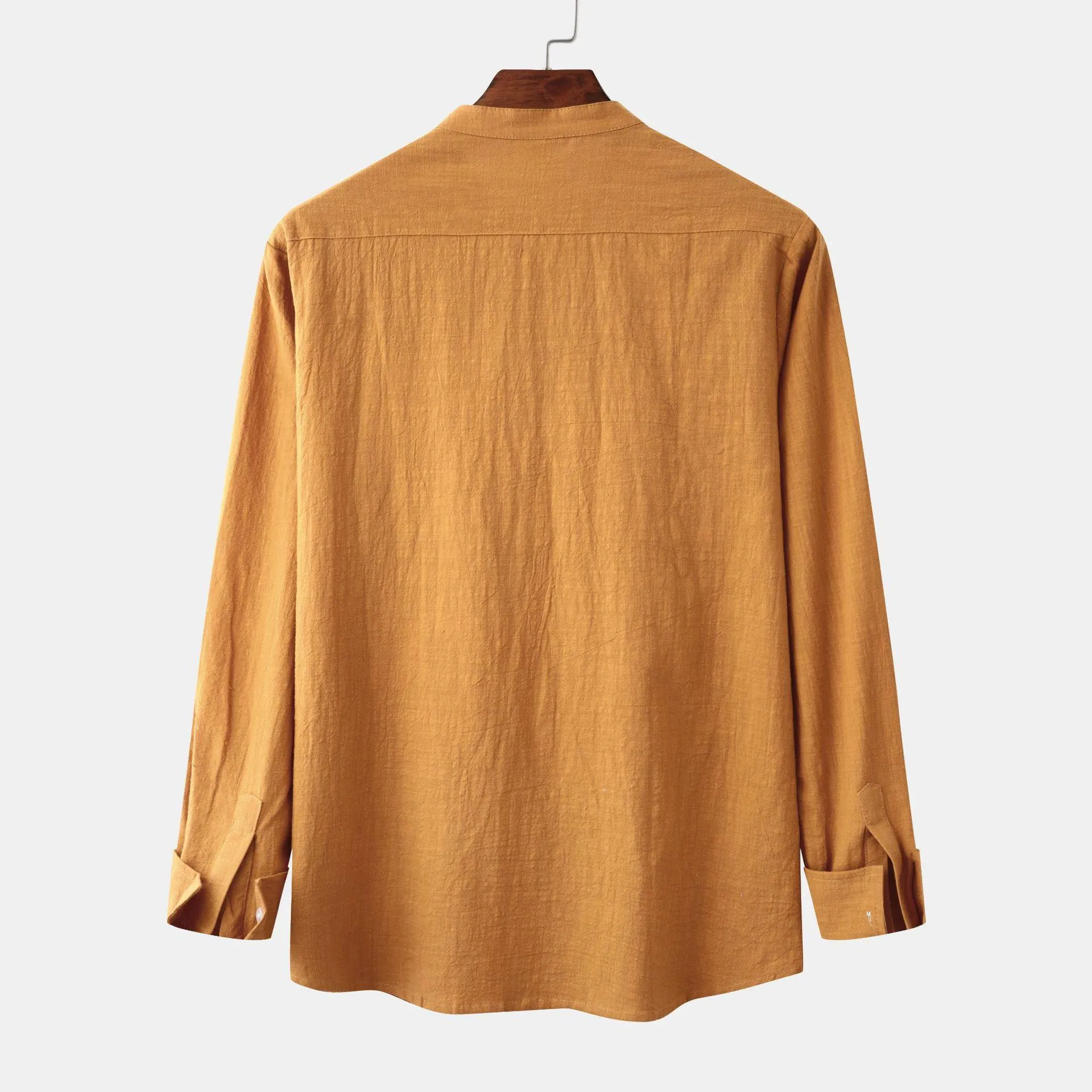 Men's brown slim cotton blend shirt with long sleeves on mannequin showing fitted design
