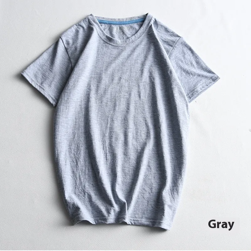Men's solid colour cotton T-shirt on a hanger, showing round neck and short sleeve design.