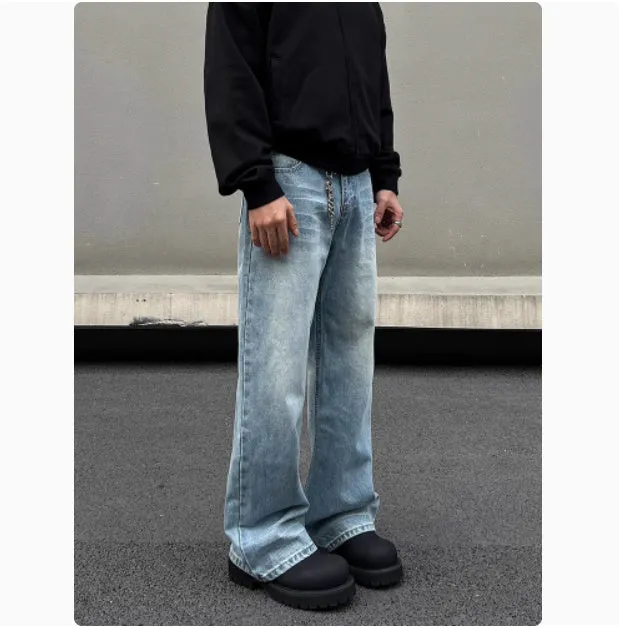 Men's blue straight-leg jeans with whisker wash detailing and a flared leg.