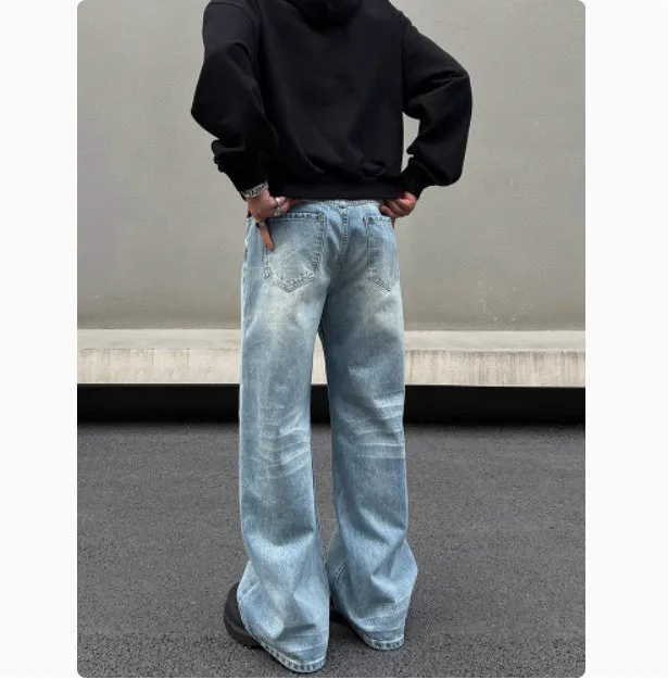 Men's blue straight-leg jeans with whisker wash detailing and a flared leg.