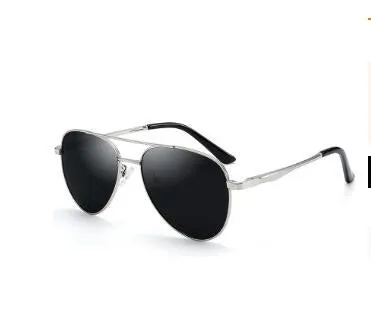 Retro classic vintage sunglasses with gold frame and black grey TAC polarised lenses on a white background