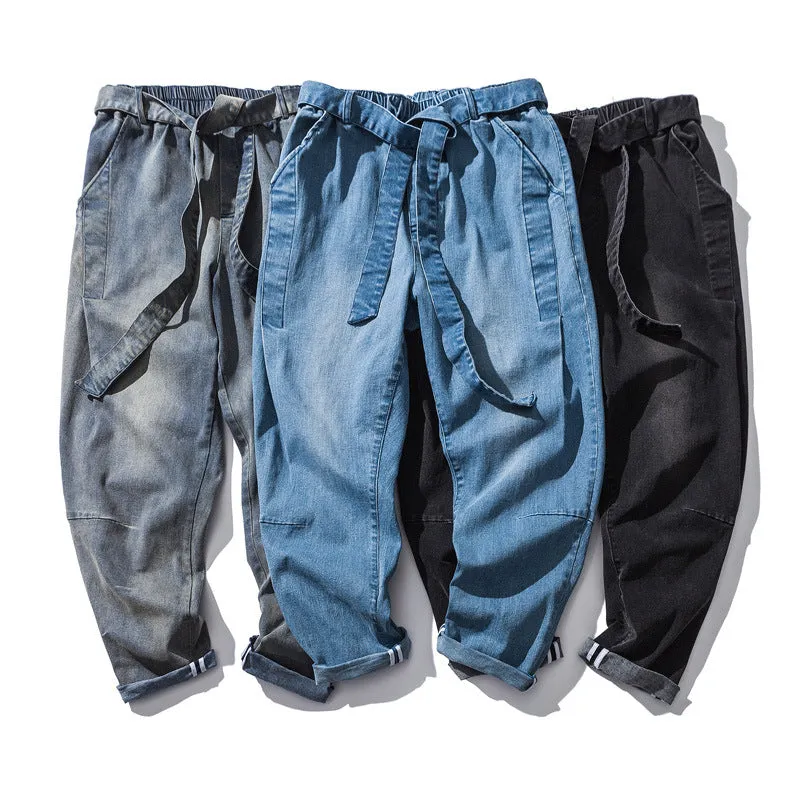 Punk stretch bike denim jeans in solid colour with elastic waist and patches