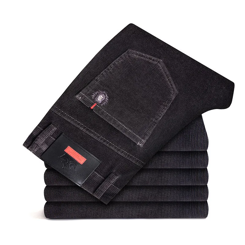 Men's thick corduroy straight trousers with belt in dark grey, shown folded on a neutral background.