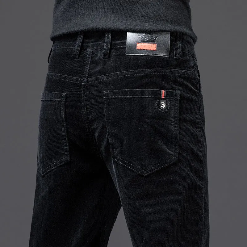Men's thick corduroy straight trousers with belt in dark grey, shown folded on a neutral background.