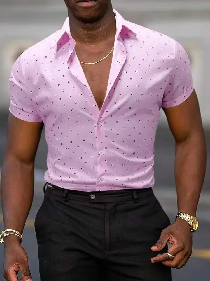 Man wearing a light blue short-sleeved casual shirt with a floral print pattern.
