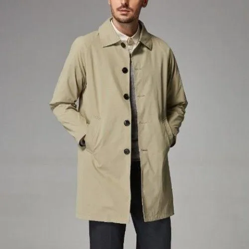 Man wearing a khaki-coloured, loose-fit mid-length trench coat made of rabbit fur.