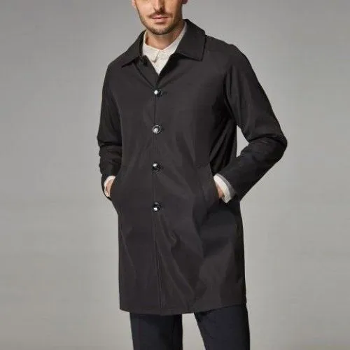 Man wearing a khaki-coloured, loose-fit mid-length trench coat made of rabbit fur.